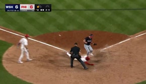 Bryson Stott scores on a wild pitch from Kyle Finnegan, securing the Phillies' 7-6 win over Nationals